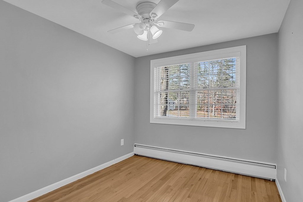 4 Radcliffe Road North Chelmsford, MA 01863 - Photo 20 of 40 wooden floor in an empty room with a window