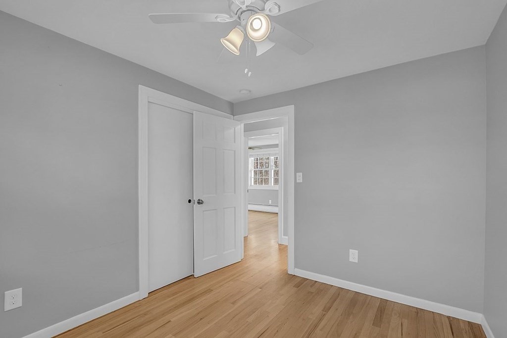 4 Radcliffe Road North Chelmsford, MA 01863 - Photo 21 of 40 a view of an empty room with wooden floor