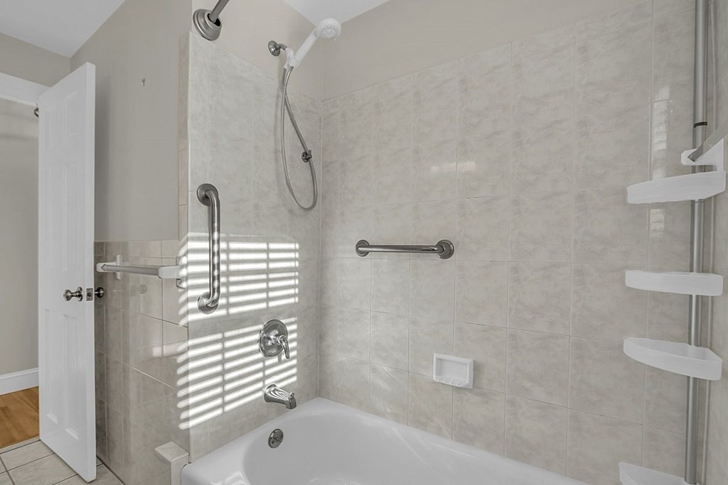 4 Radcliffe Road North Chelmsford, MA 01863 - Photo 23 of 40 a bathroom with a bathtub a shower and a toilet sink