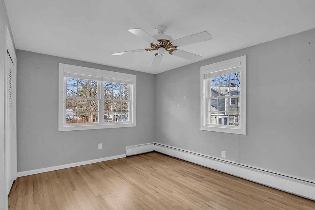 4 Radcliffe Road North Chelmsford, MA 01863 - Photo 24 of 40 a view of an empty room with a window and wooden floor