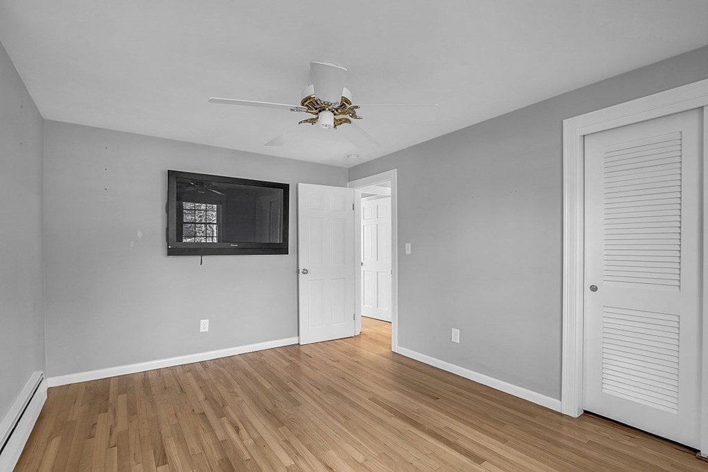 4 Radcliffe Road North Chelmsford, MA 01863 - Photo 25 of 40 a view of an empty room with wooden floor