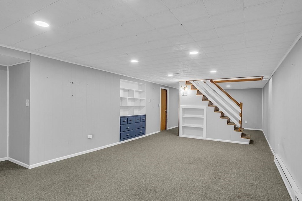 4 Radcliffe Road North Chelmsford, MA 01863 - Photo 31 of 40 a view of an empty room with stairs
