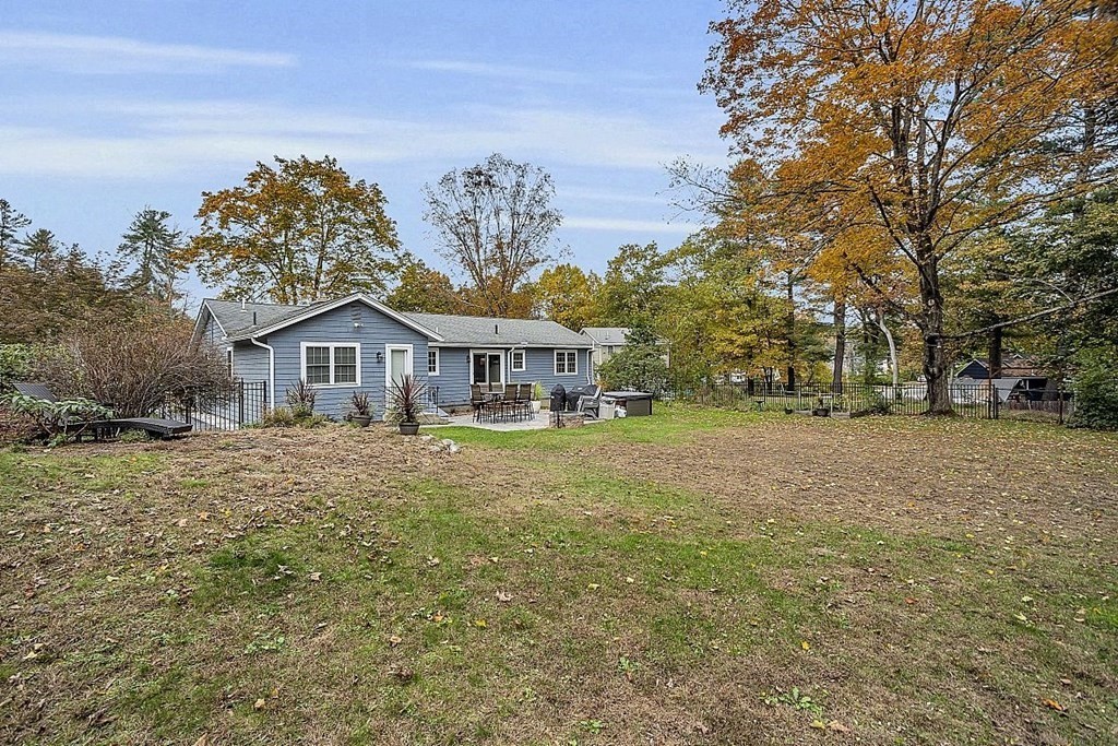 4 Radcliffe Road North Chelmsford, MA 01863 - Photo 36 of 40 a front view of house with yard and trees in the background