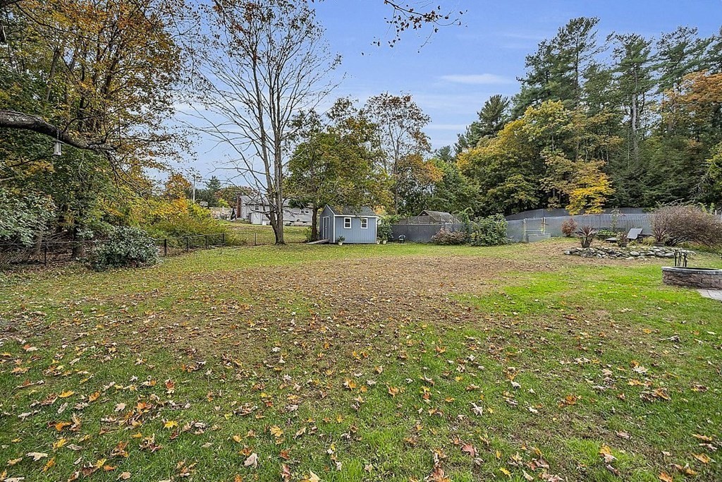 4 Radcliffe Road North Chelmsford, MA 01863 - Photo 39 of 40 a view of a field with trees in front of it