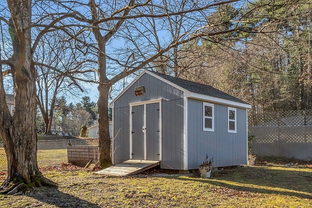 4 Radcliffe Road North Chelmsford, MA 01863 - Photo 40 of 40 a house with trees in front of it