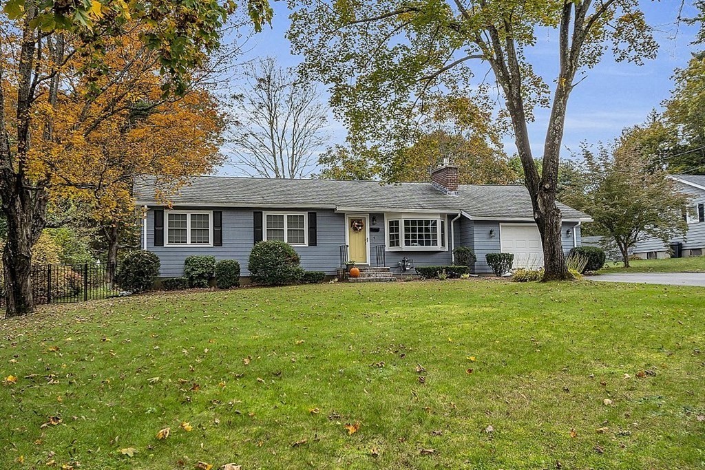 4 Radcliffe Road North Chelmsford, MA 01863 - Photo 4 of 40 a front view of a house with a garden