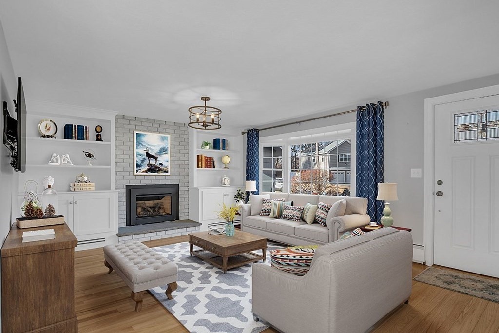4 Radcliffe Road North Chelmsford, MA 01863 - Photo 6 of 40 a living room with furniture and a fireplace