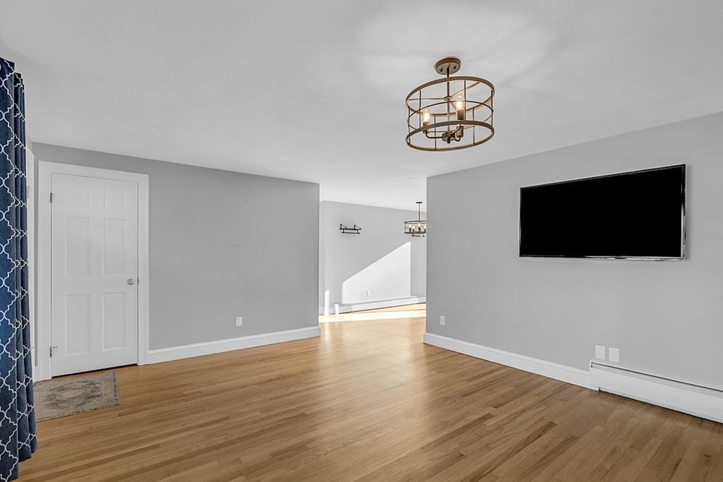 4 Radcliffe Road North Chelmsford, MA 01863 - Photo 9 of 40 a view of a livingroom with wooden floor