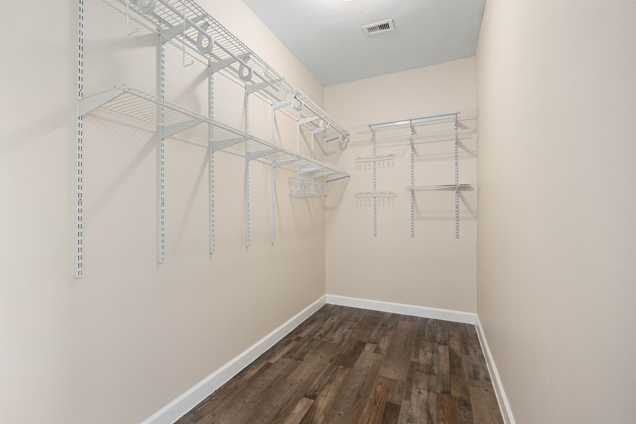 6335 Borg Breakpoint Drive Spring, TX 77379 - Photo 25 of 39 Spacious walk-in closet with built-in shelving and ample storage space.