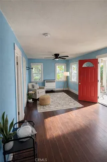 a spacious bedroom with a bed and a large window