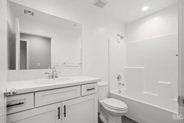 a view of storage and utility room with wooden floor