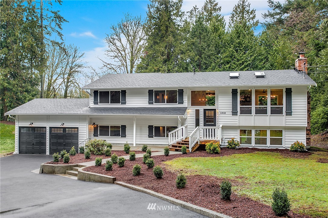 23028 35th Avenue Southeast Bothell, WA 98021 - Photo 1 of 25 front view of a house with a yard