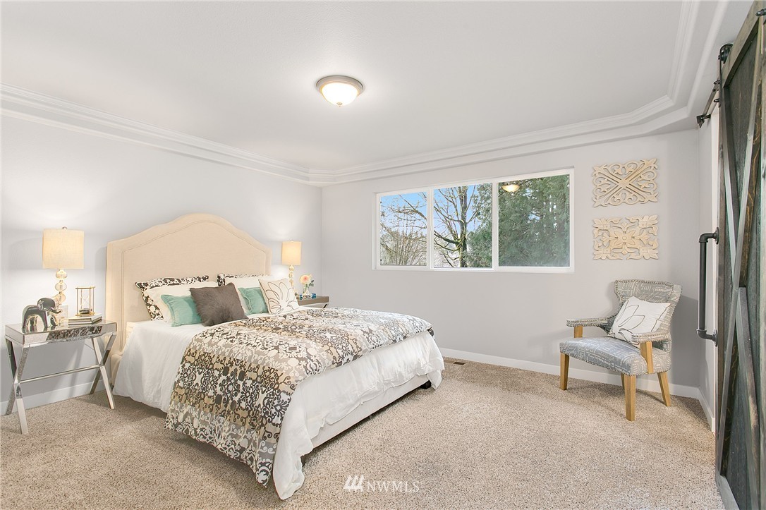 23028 35th Avenue Southeast Bothell, WA 98021 - Photo 13 of 25 a bedroom with a bed and a window