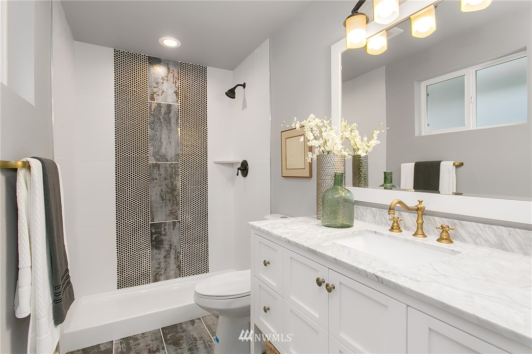 23028 35th Avenue Southeast Bothell, WA 98021 - Photo 15 of 25 a bathroom with a granite countertop sink toilet and shower