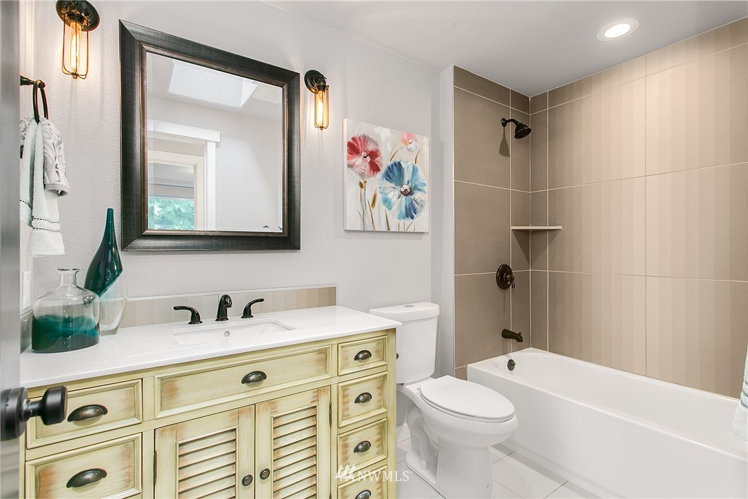 23028 35th Avenue Southeast Bothell, WA 98021 - Photo 17 of 25 a bathroom with a sink a toilet and a mirror