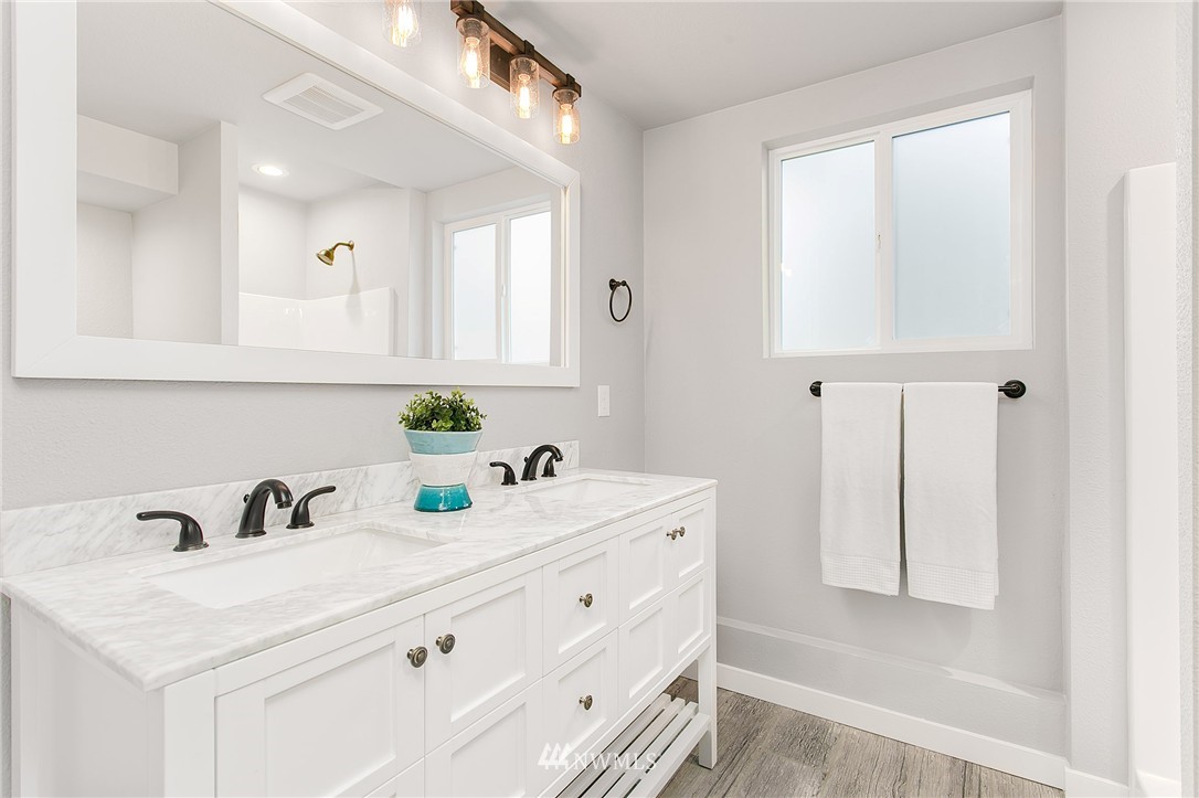 23028 35th Avenue Southeast Bothell, WA 98021 - Photo 21 of 25 a bathroom with a sink and a mirror
