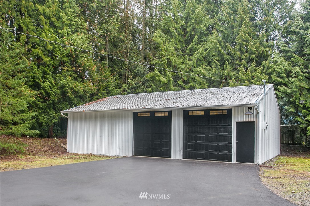 23028 35th Avenue Southeast Bothell, WA 98021 - Photo 22 of 25 a front view of a house with a garage