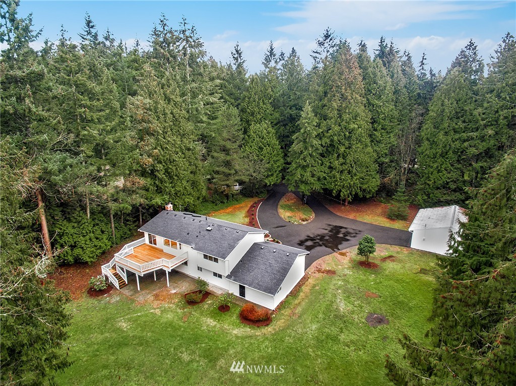 23028 35th Avenue Southeast Bothell, WA 98021 - Photo 6 of 25 an aerial view of a house with garden space and trees