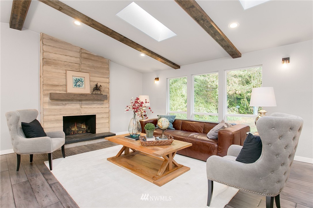 23028 35th Avenue Southeast Bothell, WA 98021 - Photo 10 of 25 a living room with furniture fireplace and a large window
