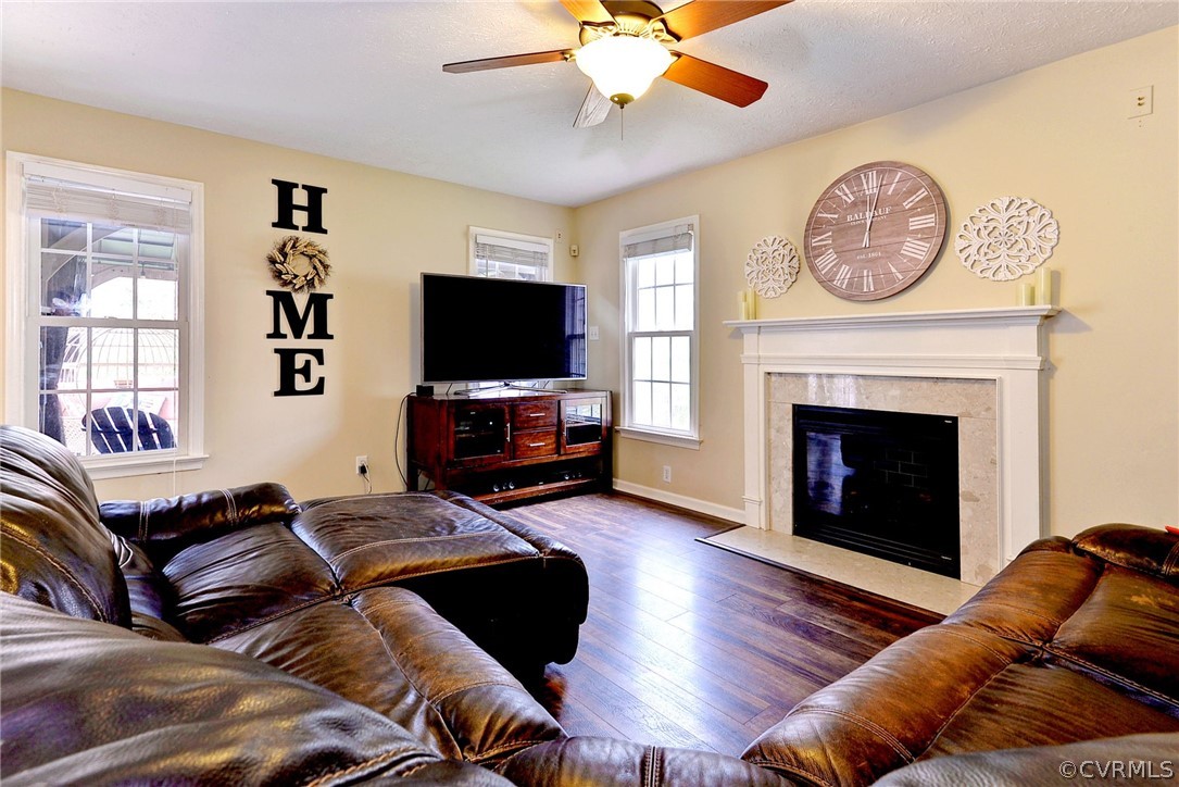 8416 Down Patrick Way Williamsburg, VA 23188 - Photo 17 of 47 a living room with furniture a fireplace and a flat screen tv