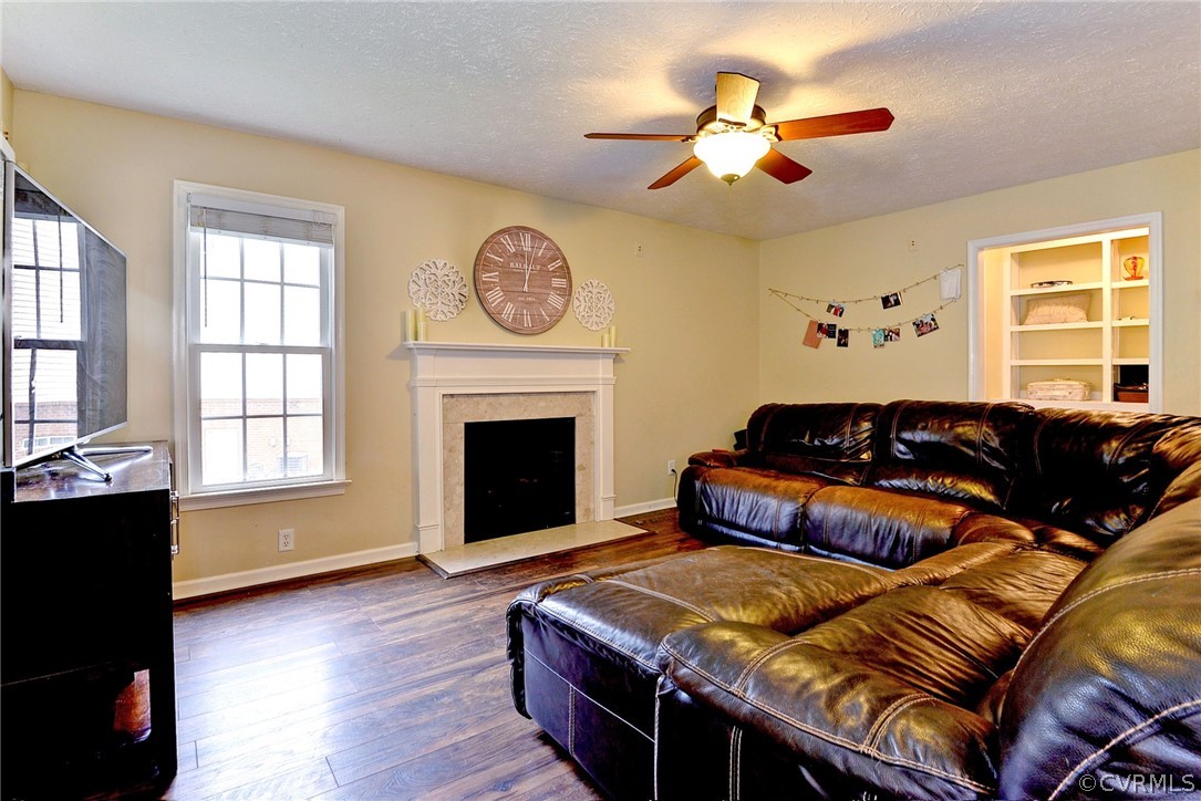 8416 Down Patrick Way Williamsburg, VA 23188 - Photo 18 of 47 a living room with furniture fireplace and window