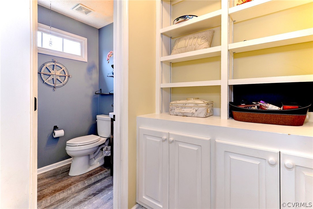 8416 Down Patrick Way Williamsburg, VA 23188 - Photo 19 of 47 a bathroom with a toilet a sink and a shower