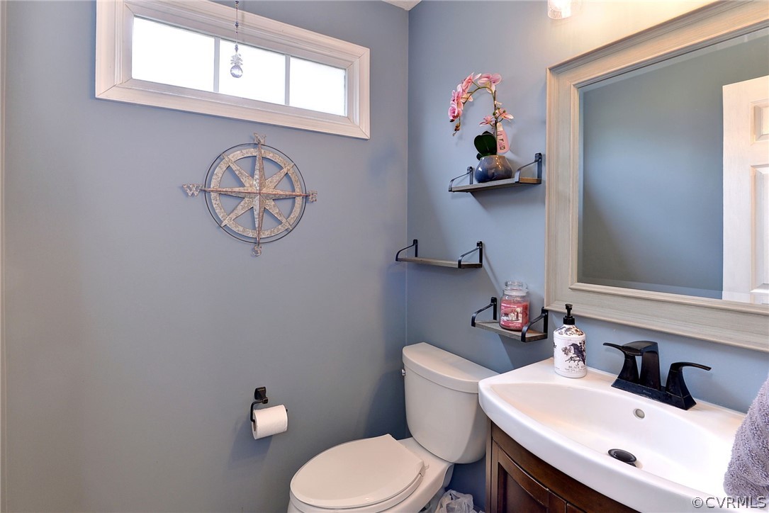 8416 Down Patrick Way Williamsburg, VA 23188 - Photo 20 of 47 a bathroom with a sink mirror and toilet