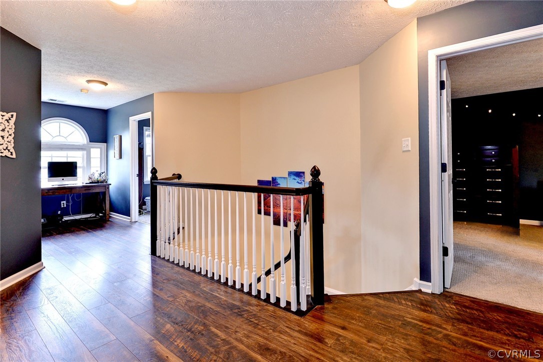 8416 Down Patrick Way Williamsburg, VA 23188 - Photo 23 of 47 a view of a room with wooden floor and stairs