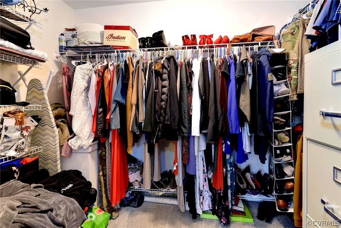 8416 Down Patrick Way Williamsburg, VA 23188 - Photo 26 of 47 a view of walk in closet with clothes and shoes