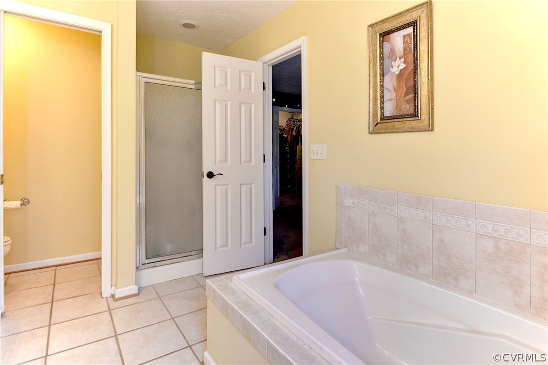8416 Down Patrick Way Williamsburg, VA 23188 - Photo 28 of 47 a bathroom with a bathtub and shower