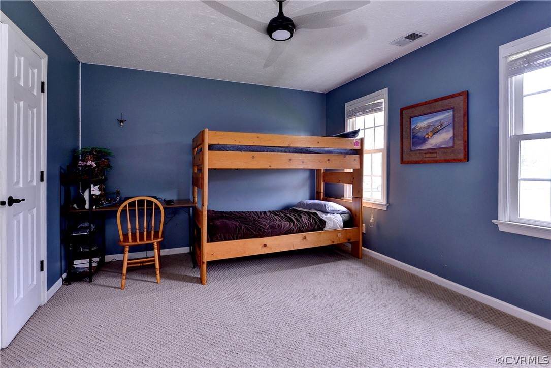 8416 Down Patrick Way Williamsburg, VA 23188 - Photo 31 of 47 a bedroom with bed and a window
