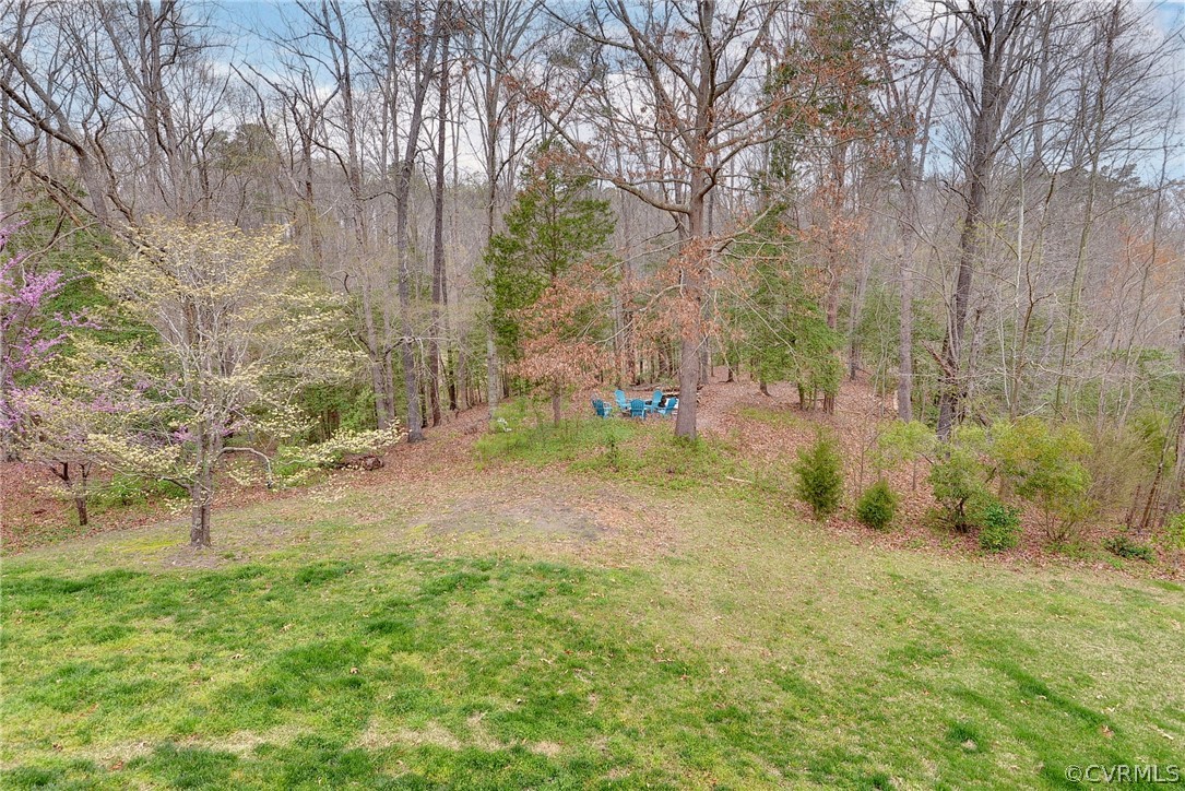 8416 Down Patrick Way Williamsburg, VA 23188 - Photo 36 of 47 a backyard of a house with lots of green space