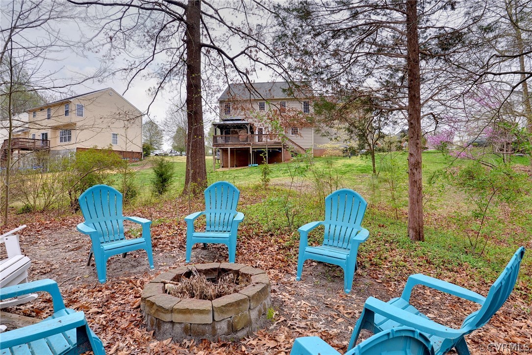 8416 Down Patrick Way Williamsburg, VA 23188 - Photo 38 of 47 a view of a chairs and table in the backyard