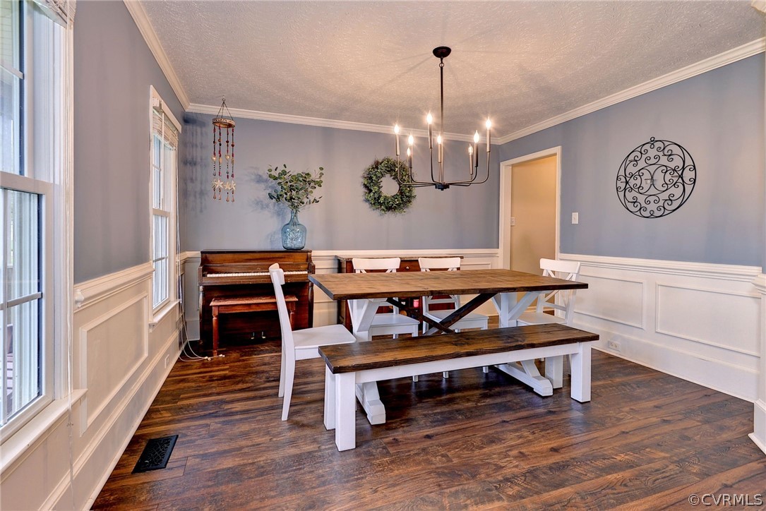 8416 Down Patrick Way Williamsburg, VA 23188 - Photo 8 of 47 a view of dining room and kitchen with furniture wooden floor and window
