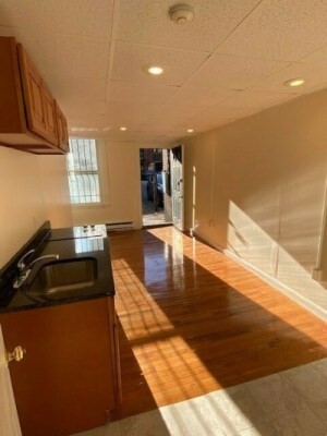 507 Beacon Street, Unit C Boston, MA 02215 - Photo 1 of 5 a kitchen with a sink and cabinets