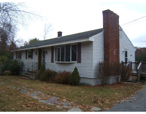276 Pommogussett Road Rutland, MA 01543 - Photo 1 of 20 a view of a house with a yard