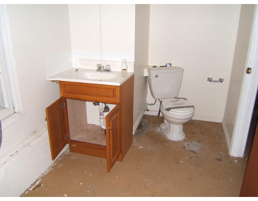 276 Pommogussett Road Rutland, MA 01543 - Photo 11 of 20 a bathroom with a toilet a sink and mirror