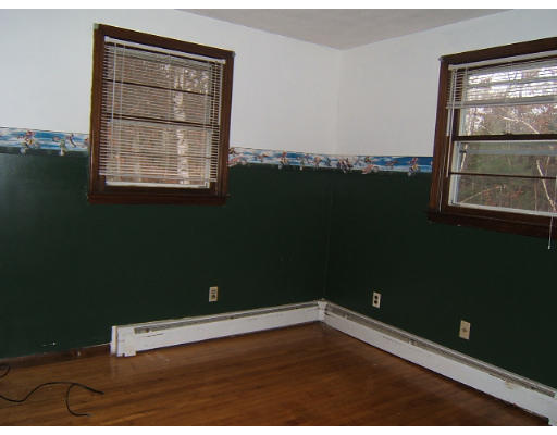 276 Pommogussett Road Rutland, MA 01543 - Photo 12 of 20 an empty room with wooden floor and windows