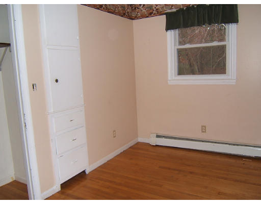 276 Pommogussett Road Rutland, MA 01543 - Photo 13 of 20 a view of an empty room with wooden floor and a window