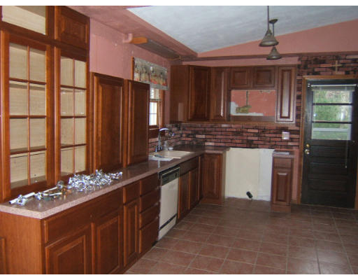276 Pommogussett Road Rutland, MA 01543 - Photo 15 of 20 a kitchen with kitchen island granite countertop a sink stove and refrigerator