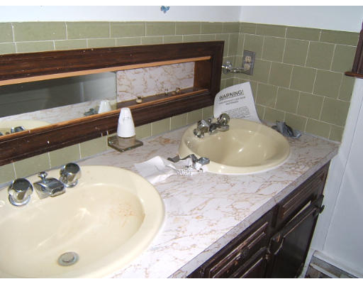 276 Pommogussett Road Rutland, MA 01543 - Photo 19 of 20 a bathroom with a granite countertop sink and a mirror