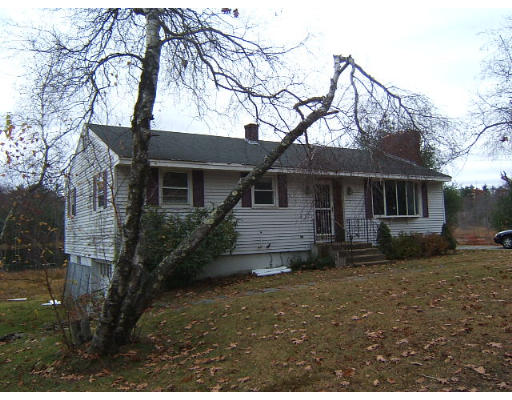 276 Pommogussett Road Rutland, MA 01543 - Photo 2 of 20 a front view of a house with a garden