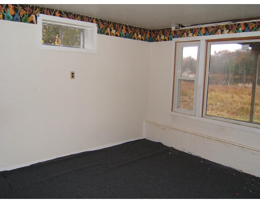 276 Pommogussett Road Rutland, MA 01543 - Photo 10 of 20 a view of an empty room with a window