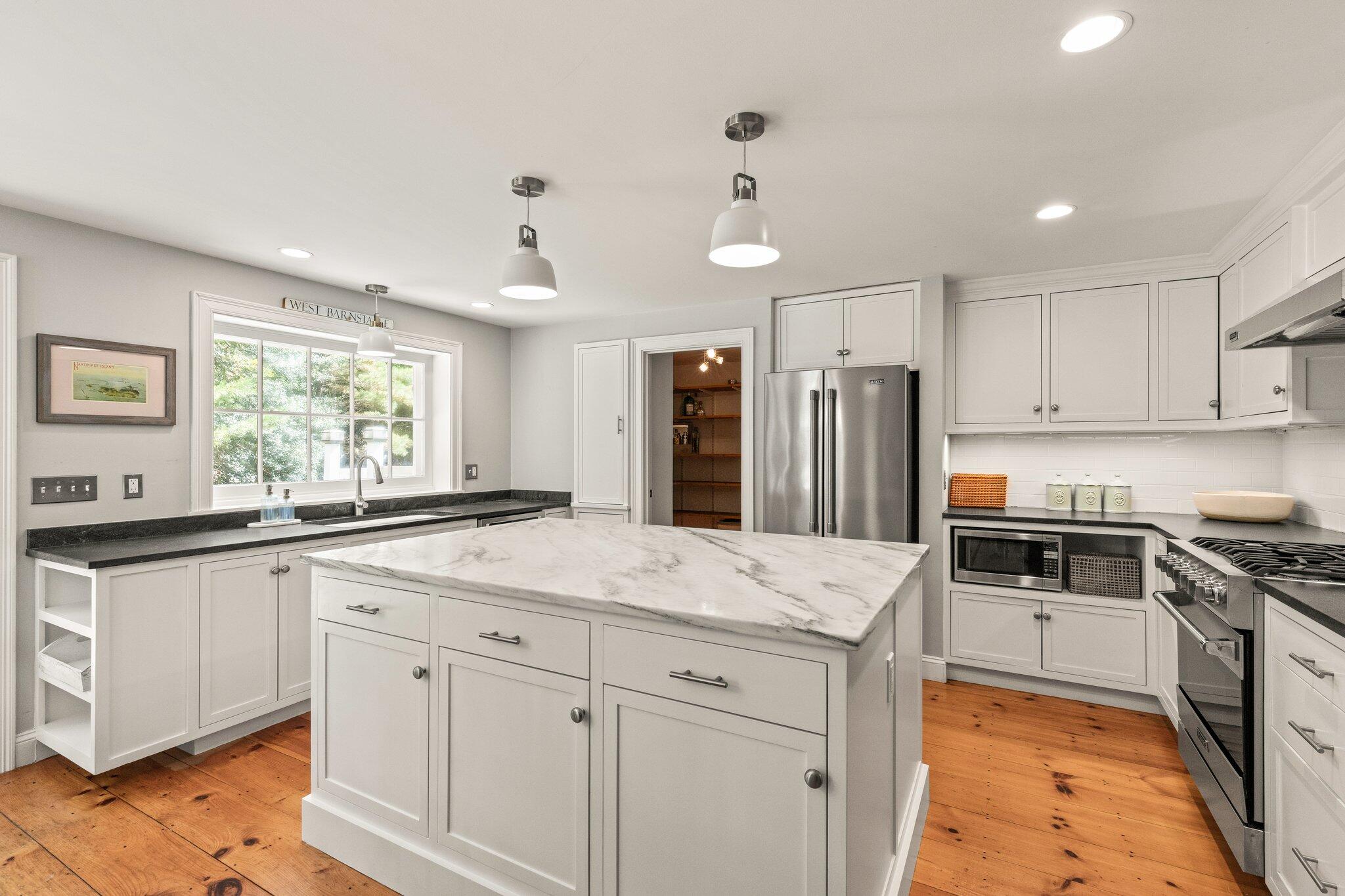 1756 Osterville West Barnstable Road West Barnstable, MA 02668 - Photo 11 of 62 a kitchen with granite countertop a sink stove and refrigerator
