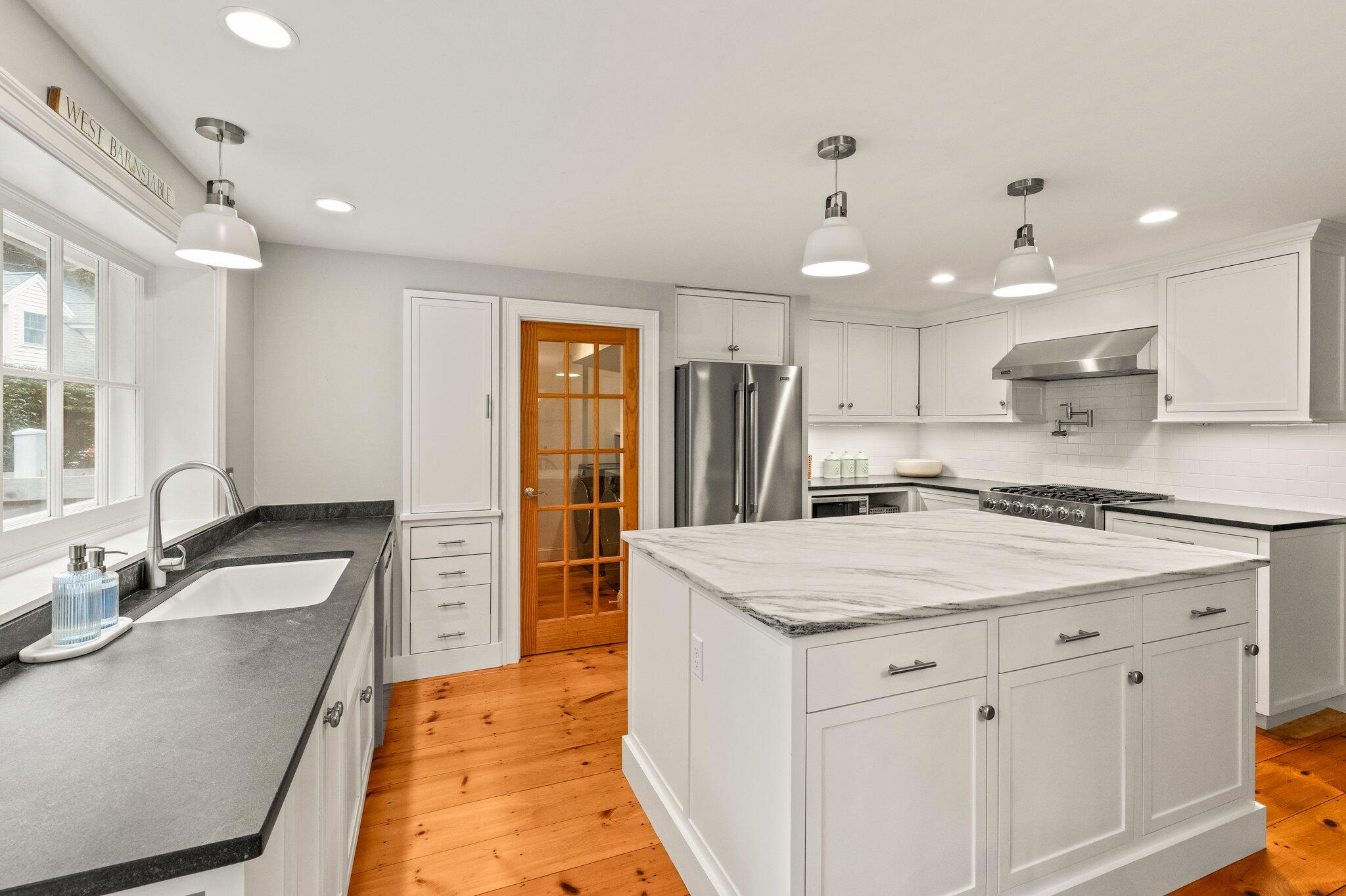 1756 Osterville West Barnstable Road West Barnstable, MA 02668 - Photo 13 of 62 a kitchen with a sink stove and refrigerator