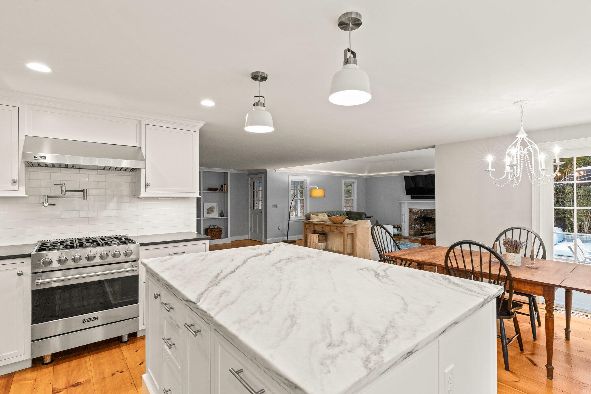 1756 Osterville West Barnstable Road West Barnstable, MA 02668 - Photo 15 of 62 a kitchen with stainless steel appliances kitchen island a stove a sink a center island a stove and a cabinets