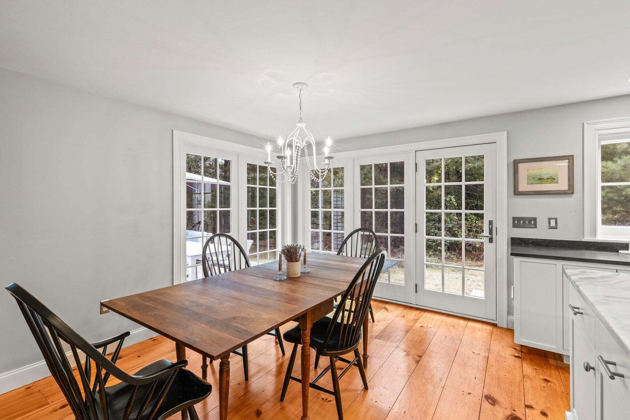 1756 Osterville West Barnstable Road West Barnstable, MA 02668 - Photo 16 of 62 a view of a dining room with furniture window and wooden floor