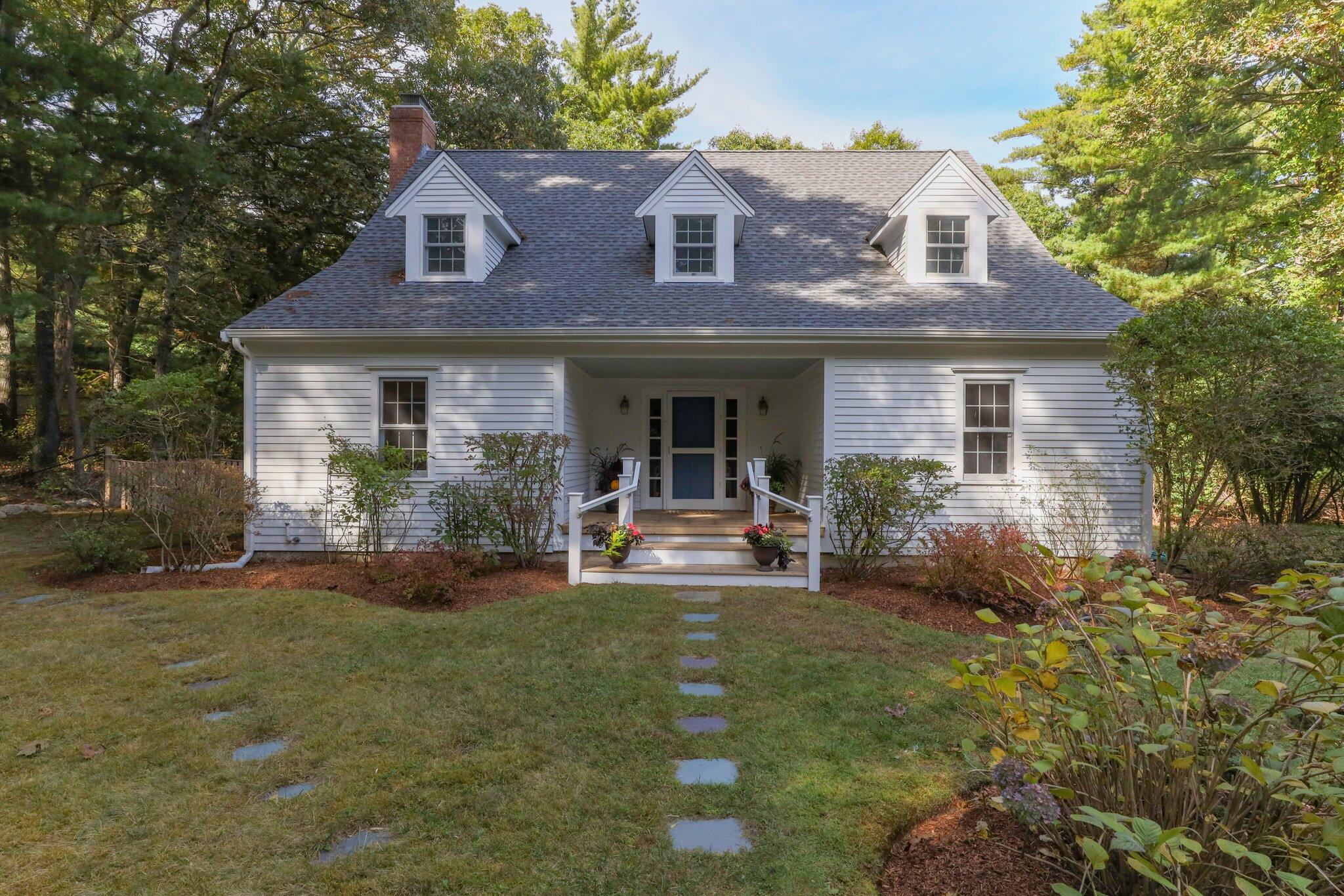 1756 Osterville West Barnstable Road West Barnstable, MA 02668 - Photo 2 of 62 a front view of a house with garden and porch