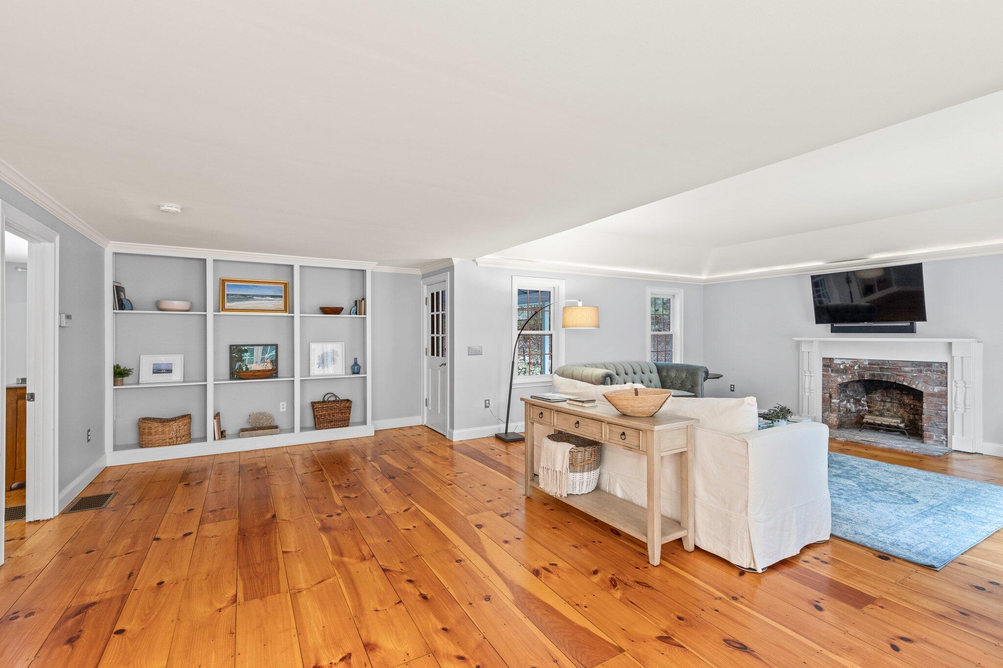 1756 Osterville West Barnstable Road West Barnstable, MA 02668 - Photo 21 of 62 a bed room with a bed and a fireplace