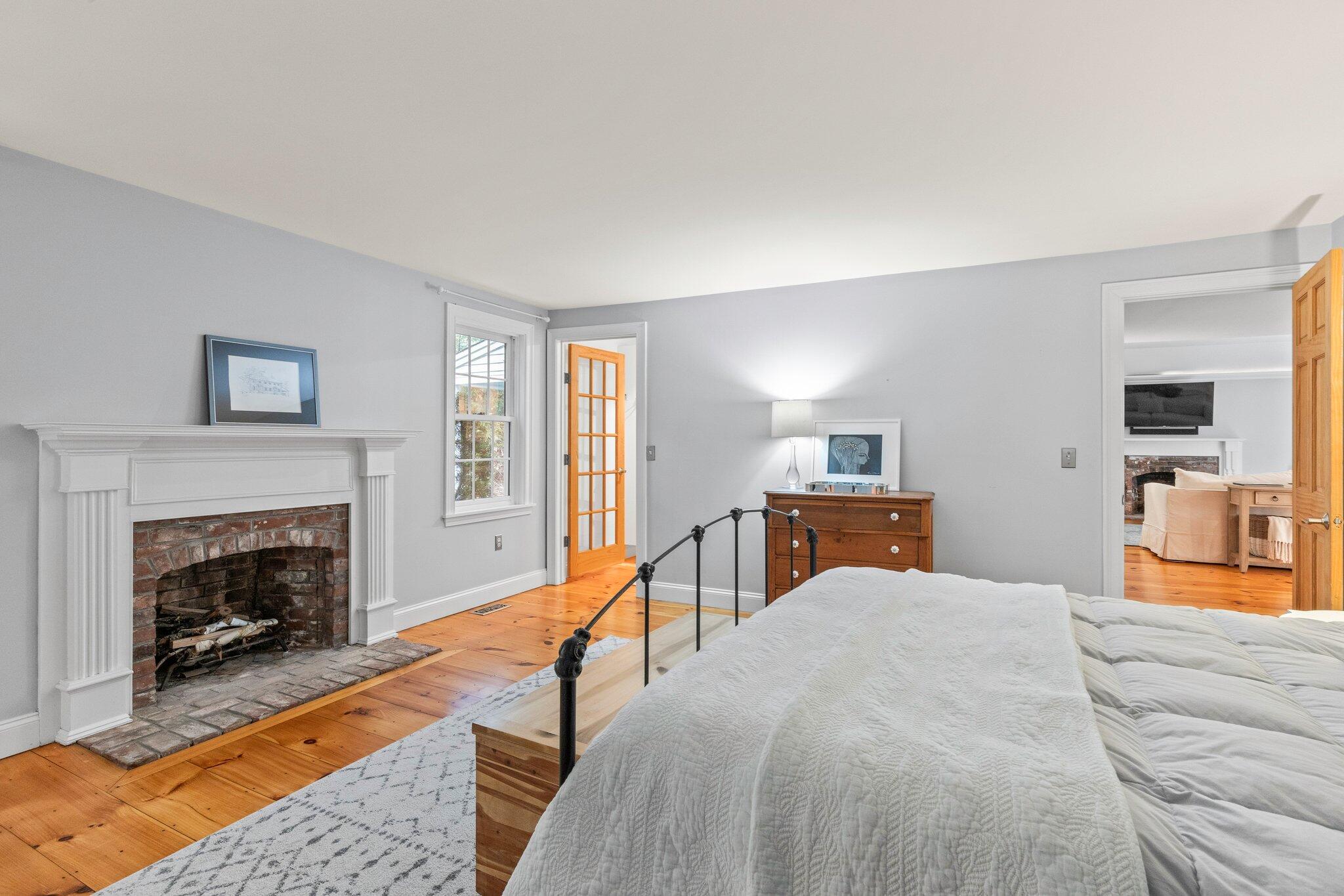 1756 Osterville West Barnstable Road West Barnstable, MA 02668 - Photo 28 of 62 a bedroom with a bed and a fireplace